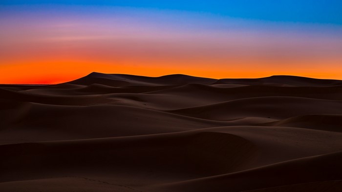 Desert dunes at sunset in Sahara, Algeria