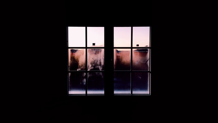 Foggy window at dusk
