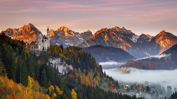Neuschwanstein Castle in the Bavarian Alps during autumn