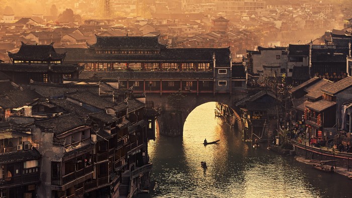 Ancient Chinese city with a river and bridge