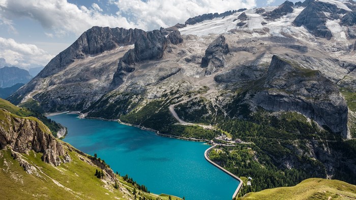 Turquoise lake and snowy mountains in the Dolomites, Italy