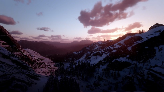 Snowy mountains at sunset in Red Dead Redemption 2