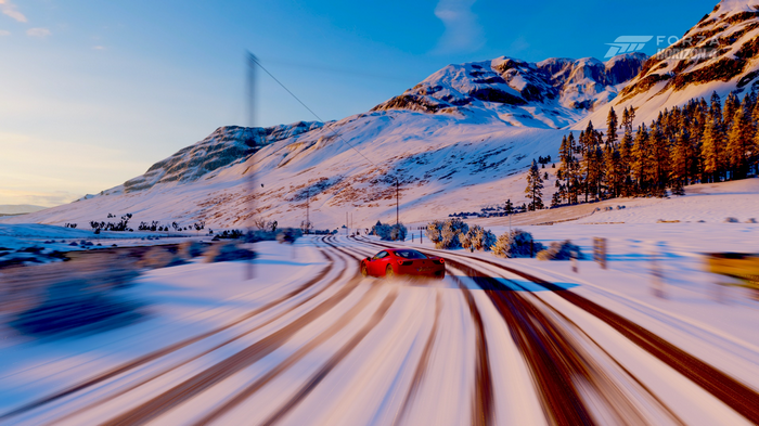 Red Ferrari 458 drifting on a snowy road in Forza Horizon 4