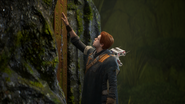 Cal Kestis from Star Wars: Jedi Fallen Order touching a wall