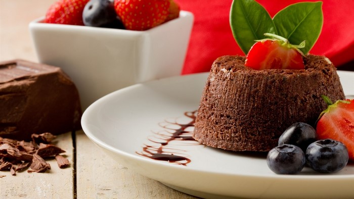 Chocolate lava cake with berries and chocolate bar