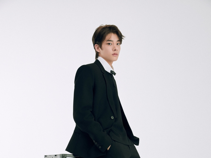 Jake ENHYPEN in a black suit
