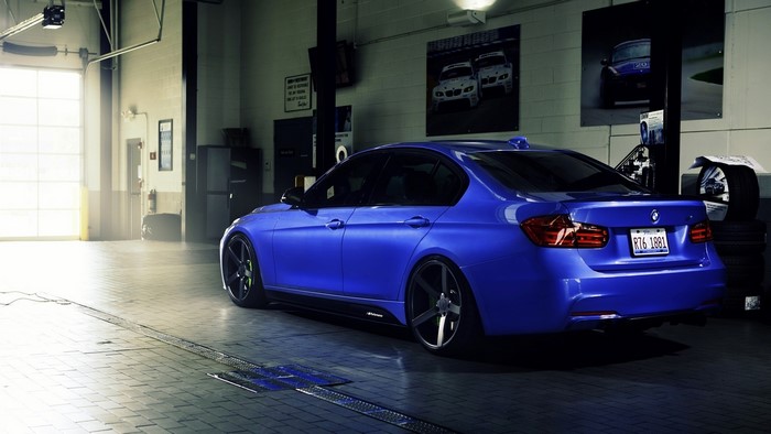 Blue BMW 3 Series in a Garage
