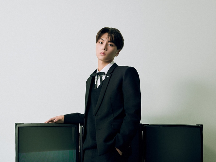 Jay ENHYPEN poses in a black suit