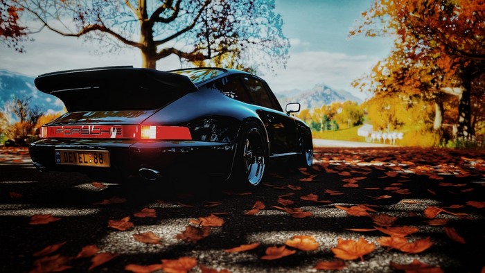 Black Porsche 964 on a Fall Road