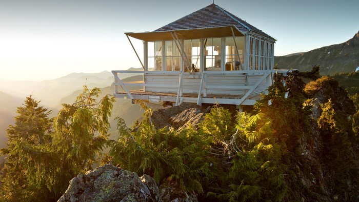 Fire lookout cabin on a rocky mountain peak in Washington