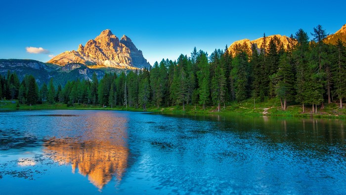 Lake reflection of Tre Cime di Lavaredo mountains in Dolomites, Italy