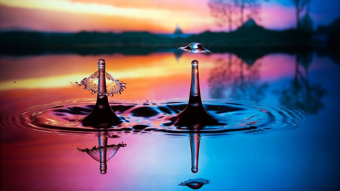 Water drops splashing at sunset