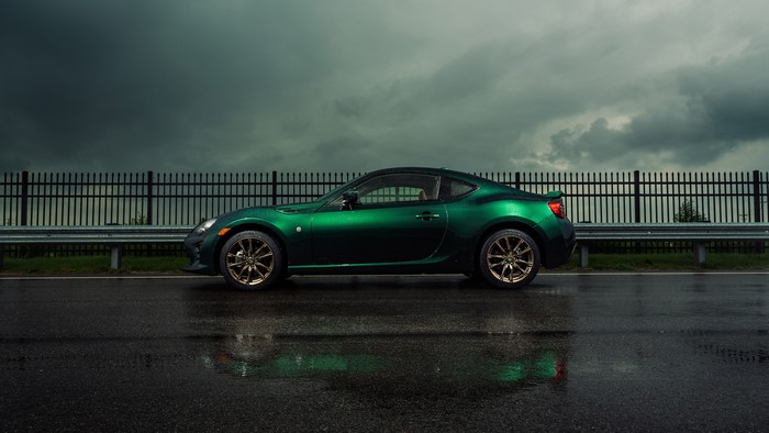 Green Toyota GT86 on a wet road