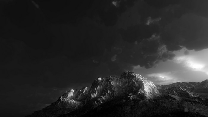 Monochrome mountain landscape with dark clouds