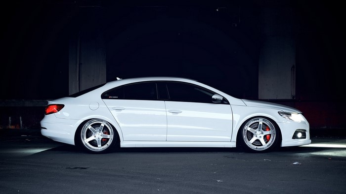 White Volkswagen CC parked in a dark area
