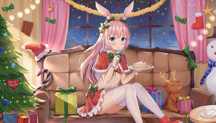 Bunny girl in Santa outfit eating cake