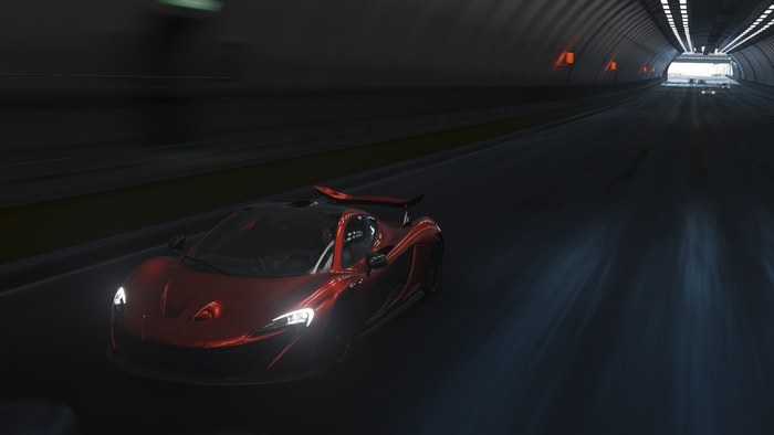 Red McLaren P1 driving through a tunnel in Forza Horizon 4