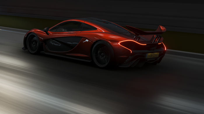 Red McLaren P1 driving on a track in Forza Horizon 4