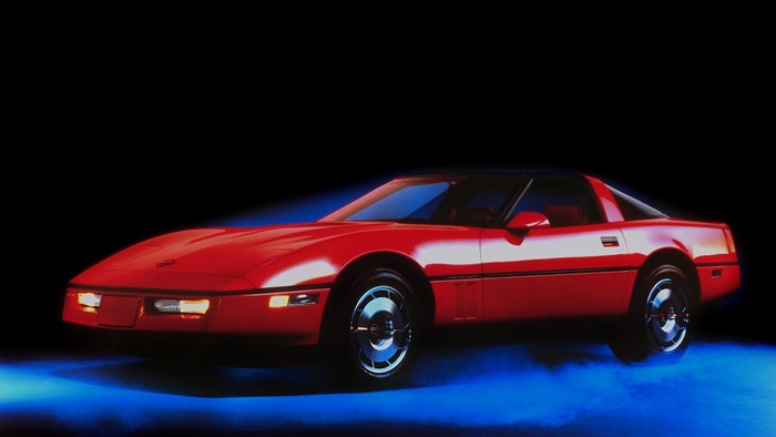 Red Chevrolet Corvette C4 with pop-up headlights