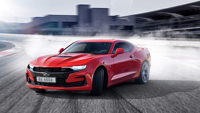 Red Chevrolet Camaro SS Drifting on Race Track