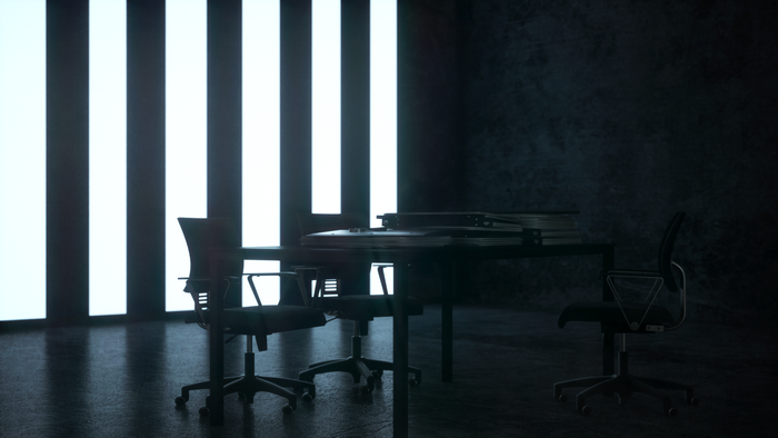 Office chairs and table with stacked papers under glowing lights