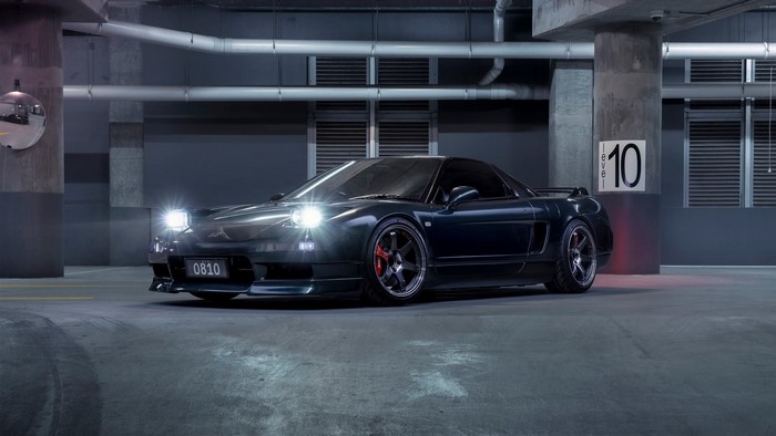 Dark Honda NSX Mk1 with Pop-up Headlights in Parking Garage