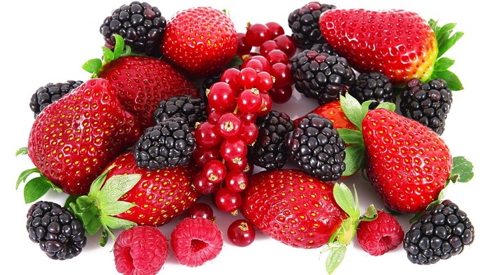 Assortment of fresh berries including strawberries, blackberries, raspberries, and red currants