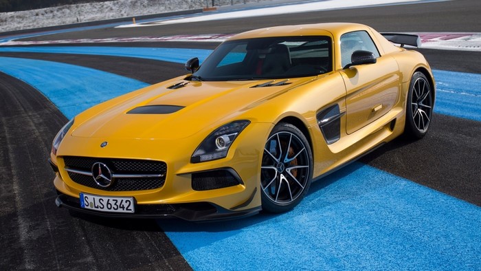 Yellow Mercedes-Benz SLS AMG on a race track