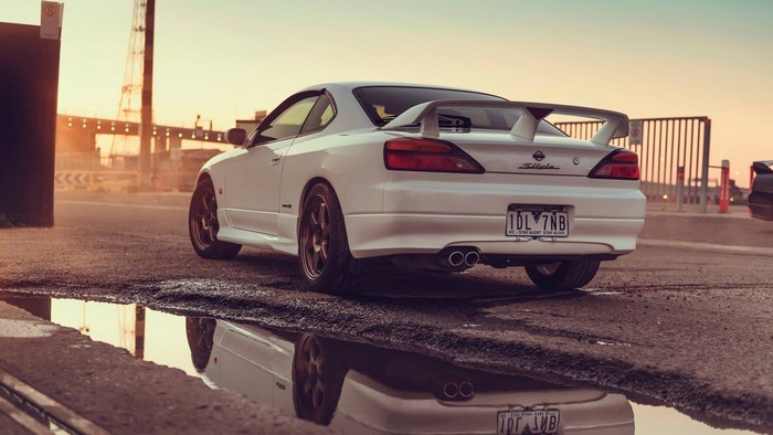 White Nissan Silvia S15 sports car with spoiler