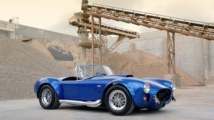 Blue Shelby Cobra 427 car at industrial gravel pit