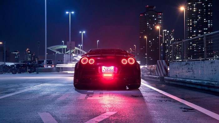 Nissan GT-R sports car at night in a city