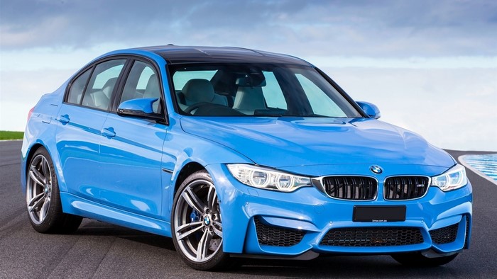 Blue BMW M3 Sedan on Asphalt Road
