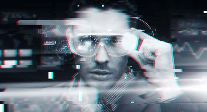 Man wearing augmented reality glasses with data displays