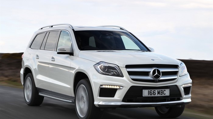White Mercedes-Benz GL driving on a road