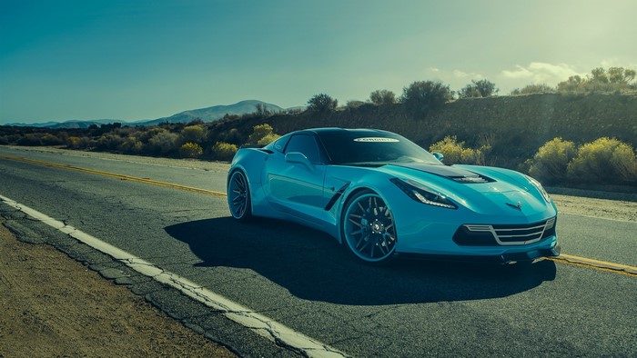 Blue Chevrolet Corvette on a Desert Road