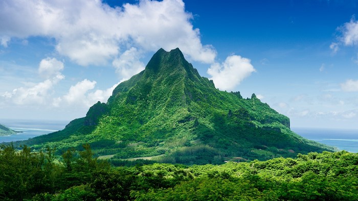Mount Rotui in French Polynesia with clouds and ocean