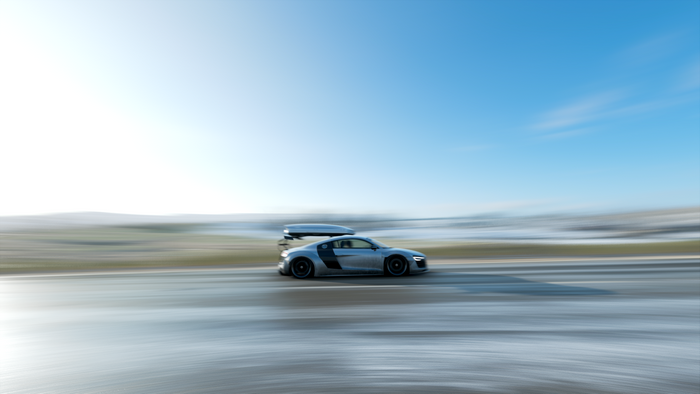 Audi R8 with roof box on a road