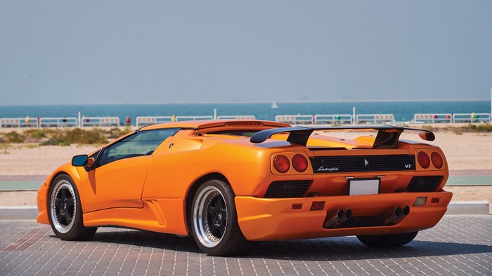 Orange Lamborghini Diablo VT Roadster on a beach
