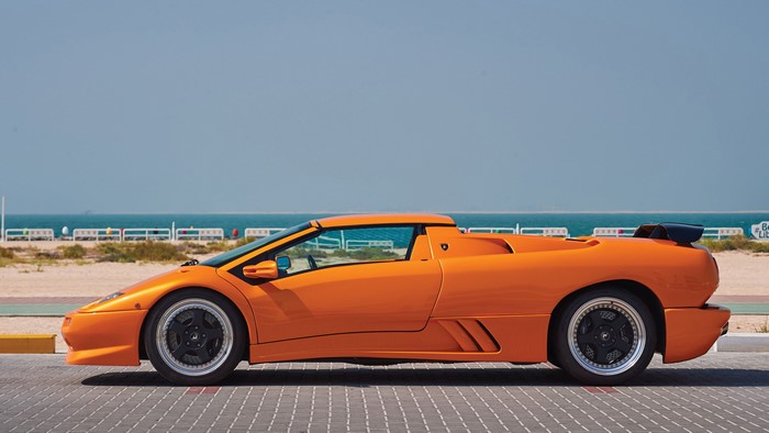 Orange Lamborghini Diablo Roadster by the Sea