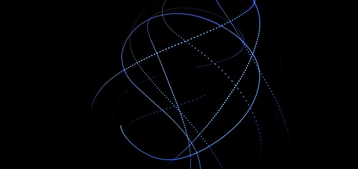 Blue light trails on black background