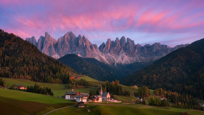 Village in the Dolomites mountains at sunset