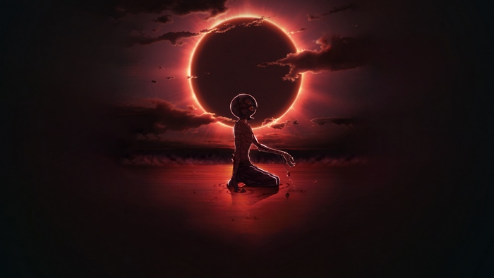 Griffith kneeling under a solar eclipse
