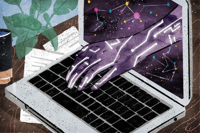 Digital hand typing on a laptop with constellations