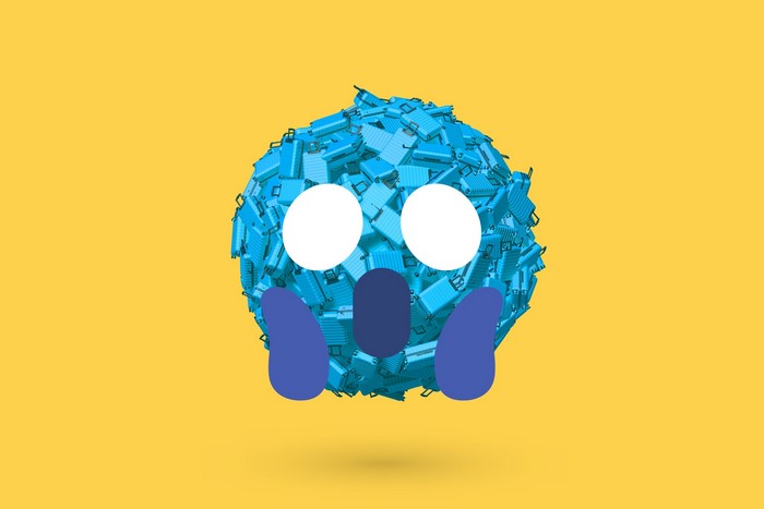 Emoji made of blue luggage on yellow background