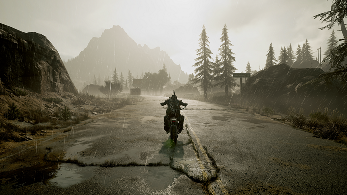 Deacon St. John riding a motorcycle in the rain