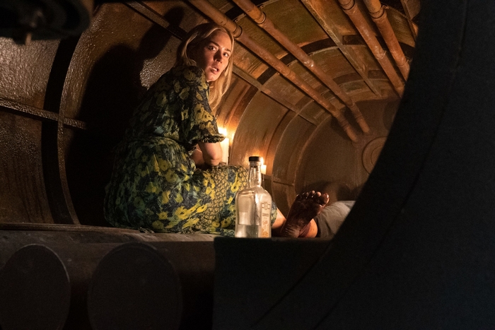 Emily Blunt as Evelyn Abbott in a confined space