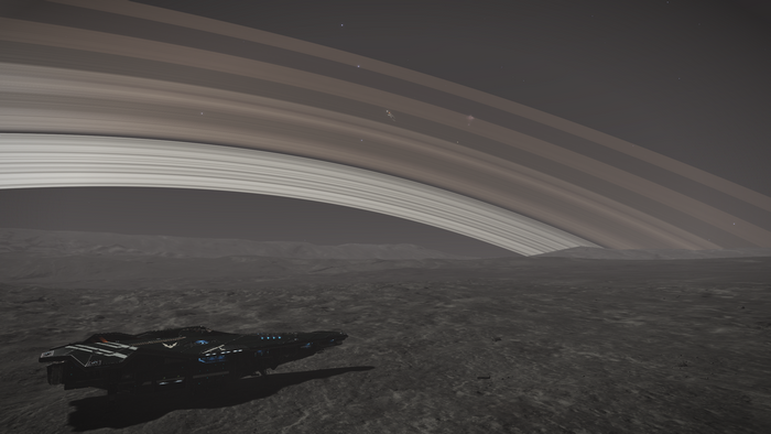 Anaconda spaceship near planetary rings in Elite: Dangerous