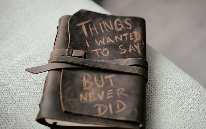Leather journal with text 'Things I wanted to say but never did'