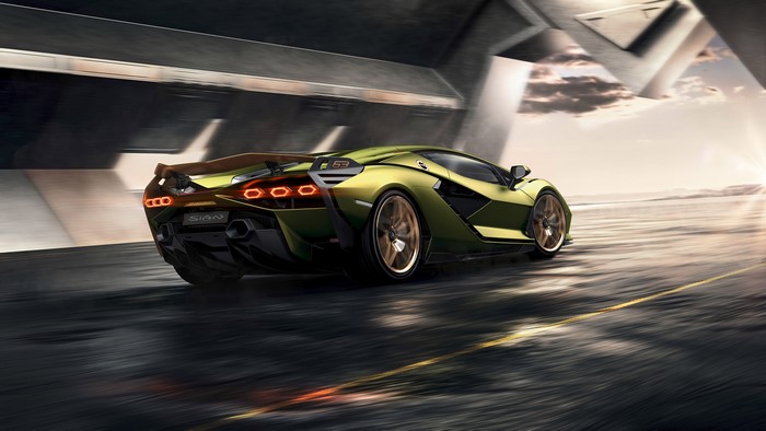 Lamborghini Sian driving on a road