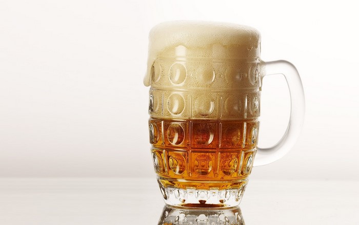 A mug of beer with foam